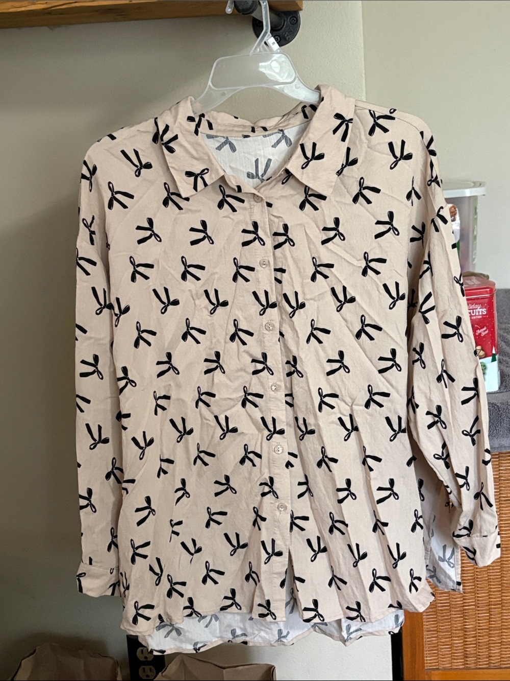 Light Pink Long-Sleeve Button-Up Blouse with Black Bow Print
